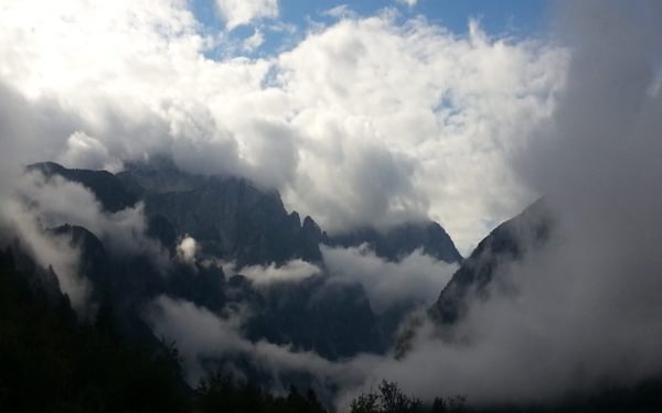Accursed Mountains Emerging From Clouds
