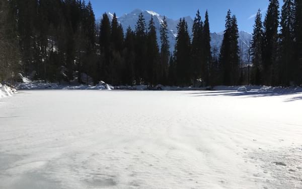 Frozen Surface Of Lac Vert With Mont Blanc Behind
