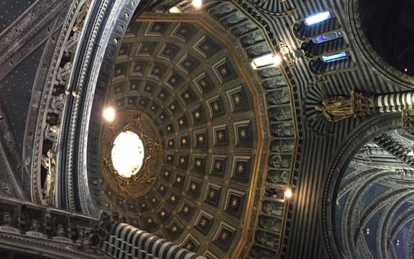 The stunning interior of the Siena Duomo, with its soaring dome. (Via Francigena)