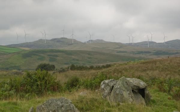 West not best: Caves of Kilhern chambered cairn, and the windfarm rising above (Stage 3)