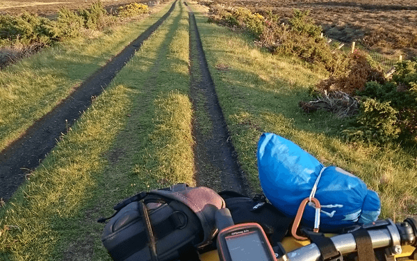 Riding home on the Dava Way, bike set up with GPS to record the route
