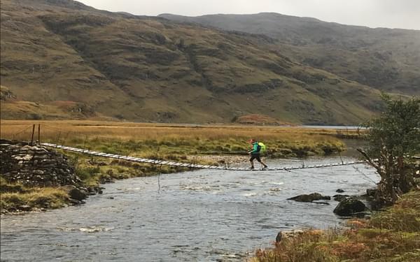 Crossing the River Carnach, Knoydart (Photo by Chris Councell)