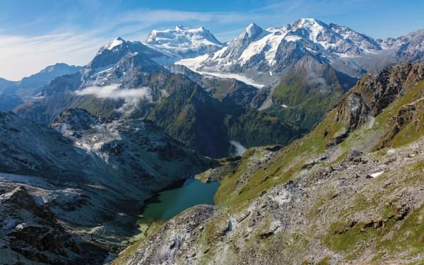 View of the Combin with Cabane de Louvie far below by the lake