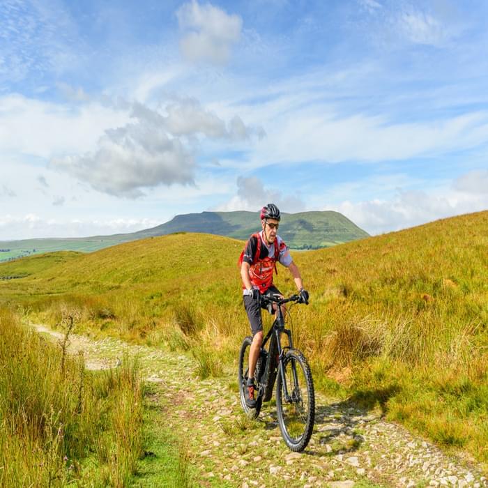 Jon Sparks near the top of Cam High Road, with Ingleborough behind, during our Pennine Bridleway ride. I would have really struggled on this long climb without a bit of e-assist.