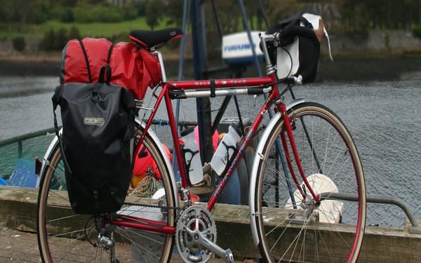 A cheap option for extra capacity is to attach a dry bag to the rack with elastics (Image by Richard Barrett)