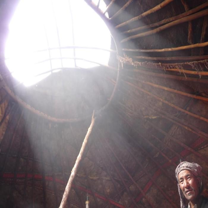Inside a yurt: sun beams enter a Kyrgyz yurt, Little Pamir
