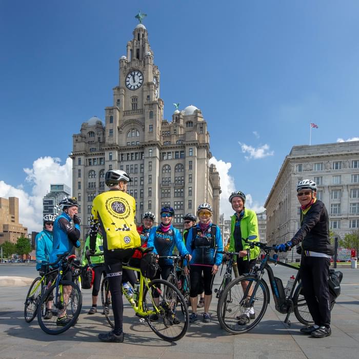 Posing beneath the Liver Building – notice the eclectic collection of bikes