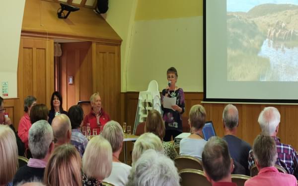 Audrey welcoming everyone to the launch, shortly before receiving a signed copy of the book