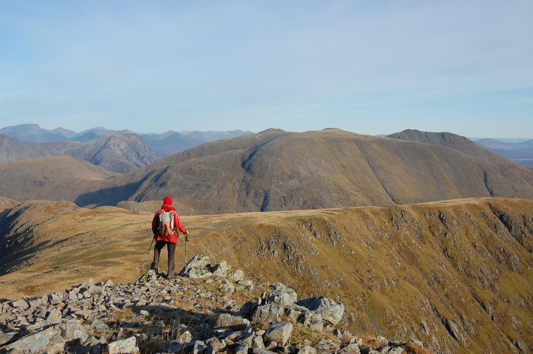 A mountain, a ridgeline, and a man in a red jacket – 'unoriginal and lacking spark' but just right for a guidebook. Stob Ghabhar