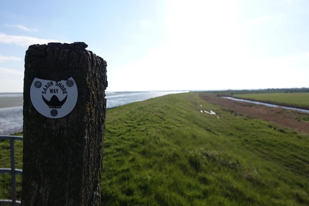 11 Saxon Shore Way marker and sea wall