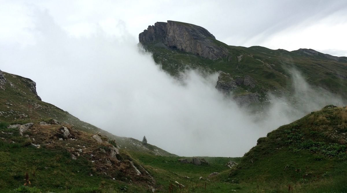 The Clouds Which Threatened Bad Weather All Day Fall Into The Mountains In The Afternoon