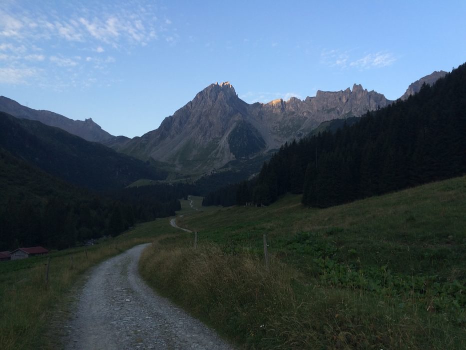 The Long Trail Ahead And The Sun Just Barely Clipping The High Ridges