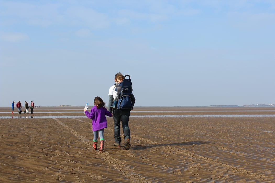 children walking to Hillbre island