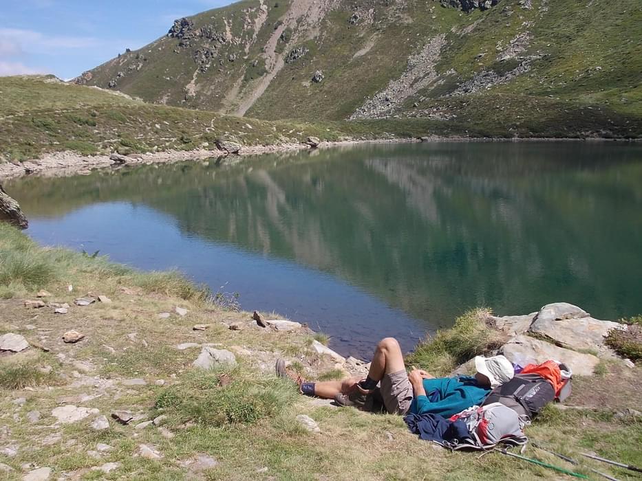 A rest by the lake is always welcome in the Pyrenees and here the author does just that on the way up to the Pinet Refuge
