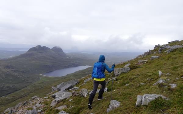 Nearing the summit of Canisp Suilven lies across Loch na Gainimh