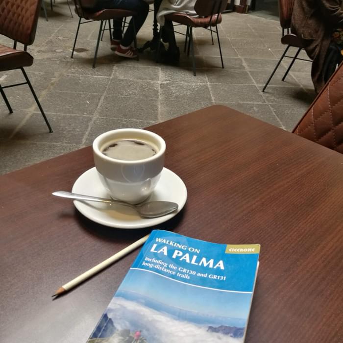 Enjoying a coffee and my guidebook for the trip, Walking on La Palma by Paddy Dillon