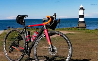 Gravel bike parked up at Penmon Point on Anglesey during a mixed tarmac/trail ride