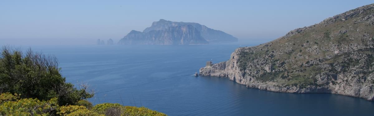 The Monti Lattari Slope Down To The Tyrrhenian Sea With The Island Of Capri Beyond