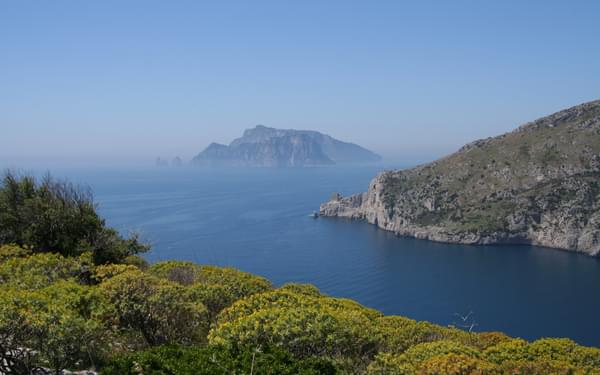 The Monti Lattari Slope Down To The Tyrrhenian Sea With The Island Of Capri Beyond