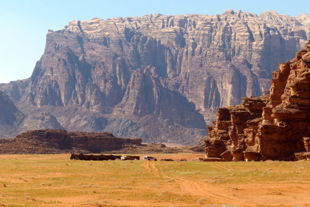 The Impressive Cliffs Of Jebel Rum Dwarf A Bedouin Camp On The Jordan Trail