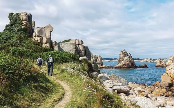 Hikers beside Crec’h Mélo on the Brittany Coast Path