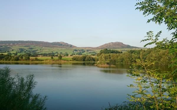 Tittesworth Reservoir with the Roaches behind in late afternoon sunlight