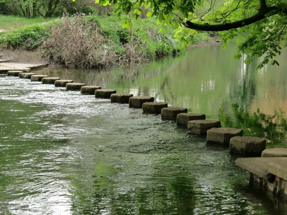 Stepping stones carry the route across the River Mole