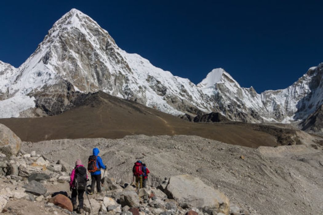 Trekkers Approaching Gorakshep In The Khumbu Valley Pumori 7161M Is On The Left And Kala Patthar Peak C 5640M Which Is One Of The Best View Points In The Everest Region Is Below It Everest Base Camp Trek Nepal