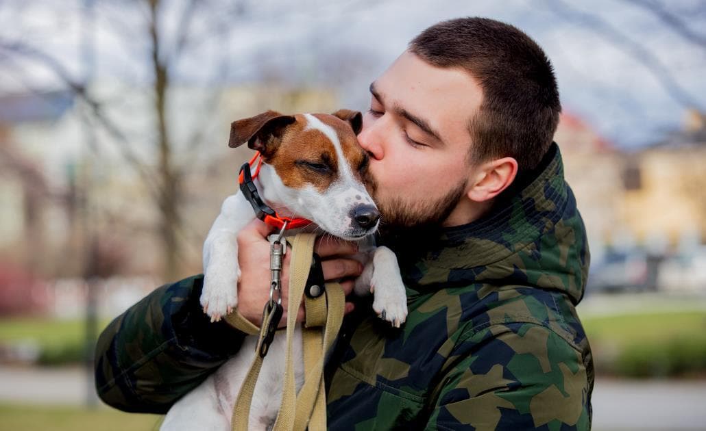 Man hugging dog