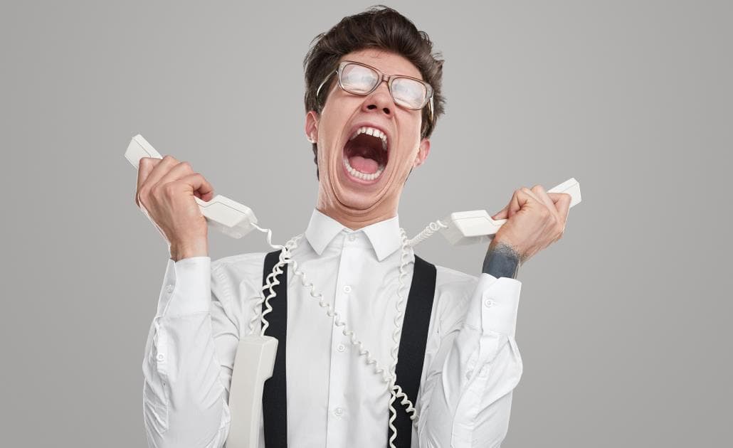 Man screaming with telephones
