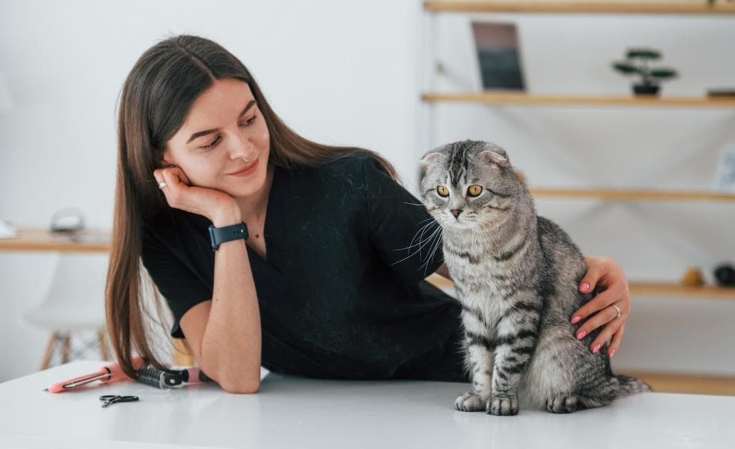 Woman looking at cat