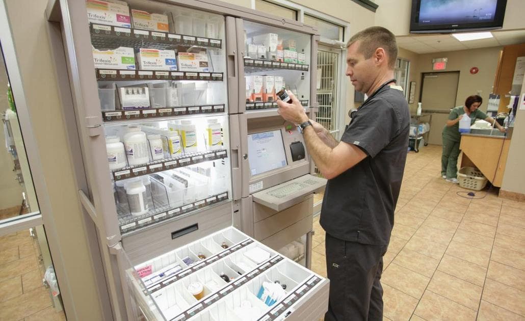 Vet using drug cabinet