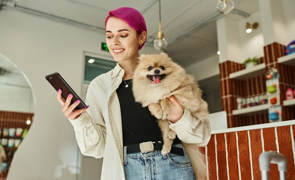 Woman holding pomeranian