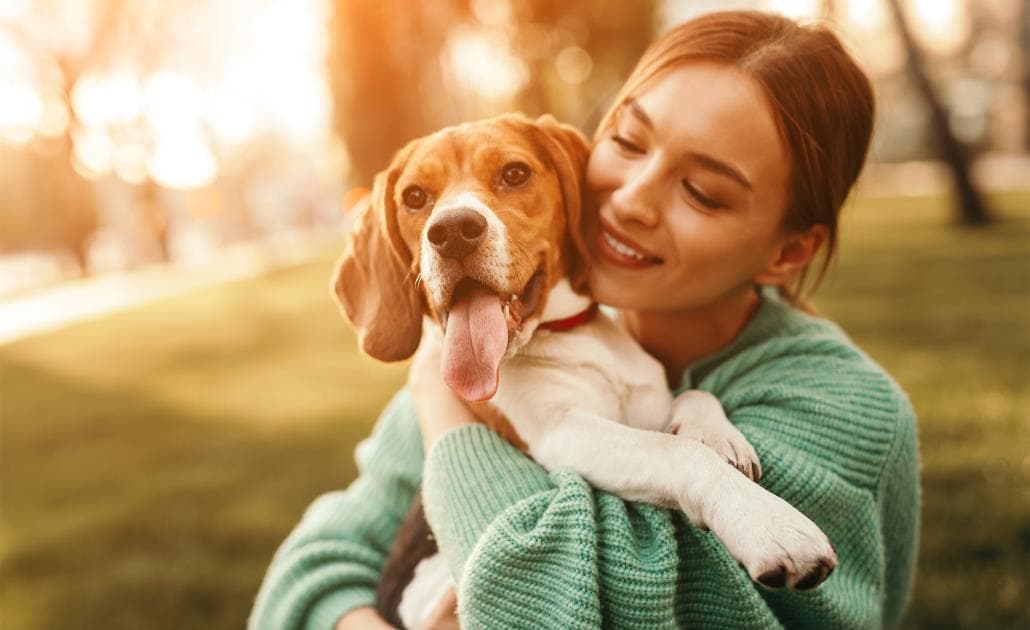 Woman hugging dog