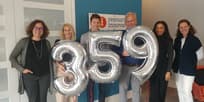 Resource Innovations executives celebrating the Inc. 5000 Fastest Growing Companies award in Half Moon Bay office