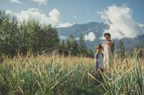 Brothers playing in wheat farm