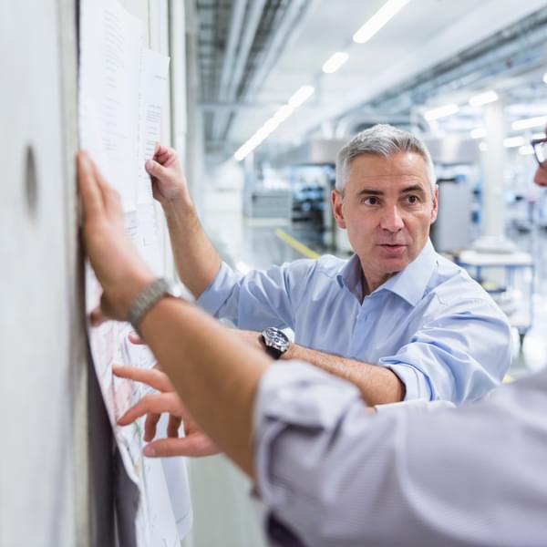 Two businessmen collaborating during meeting.