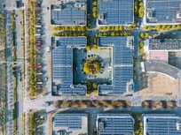 Aerial view of solar panels on the modern office building rooftop