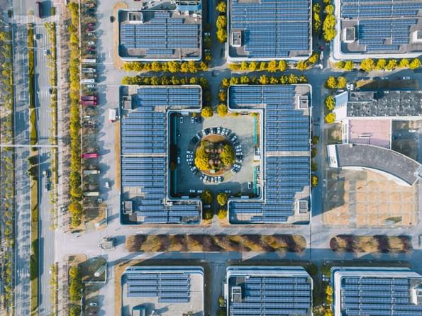 Aerial view of solar panels on the modern office building rooftop