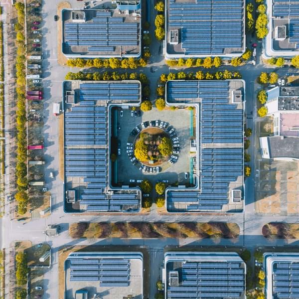 Aerial view of solar panels on the modern office building rooftop