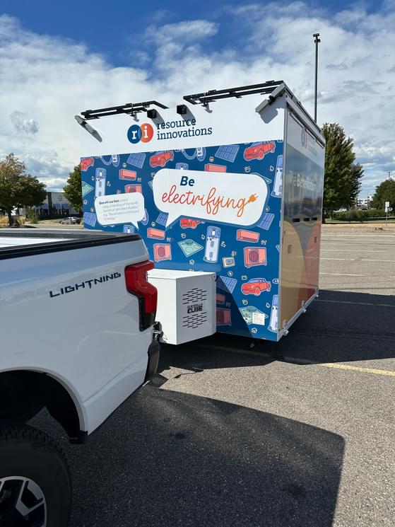 Resource Innovations' Benefication Lab hooked up to the back of a white truck and ready to be towed.