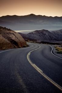 Highway at sunrise, going into Death Valley National Park