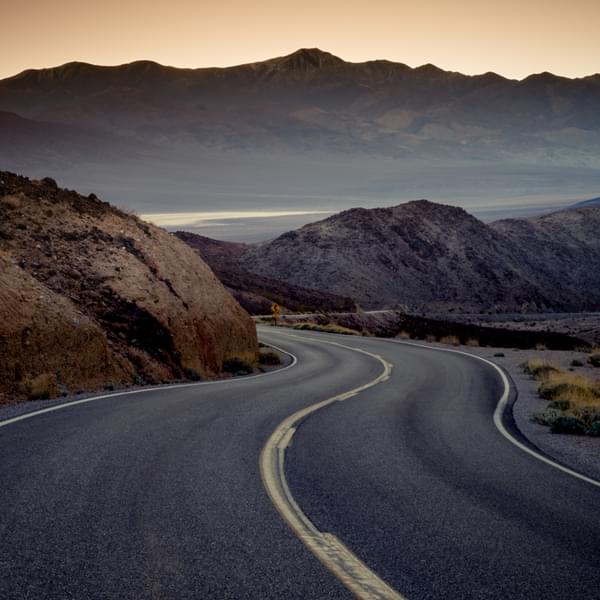 Highway at sunrise, going into Death Valley National Park