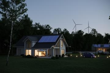 Modern energy efficient house with solar panels, wind turbines, and an electric car.