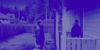 Contractor greeting customer on the porch of the house