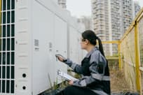 Female engineer checking HVAC