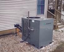 SMTI gas heat pump residential installation with view of home