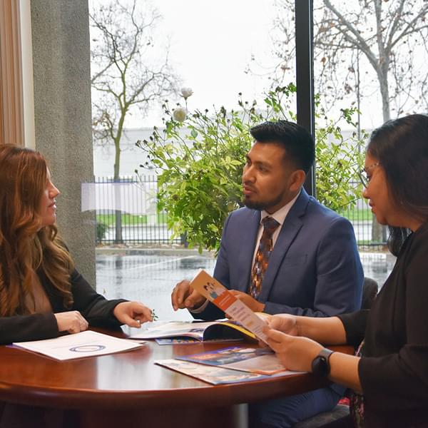 Community partners of different ethnicities having a meeting.