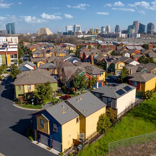 Aerial photo of downtown Sacramento with residential apartment duplexes in the foreground.