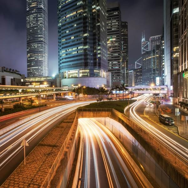 Urban traffic with cityscape at night in busy city